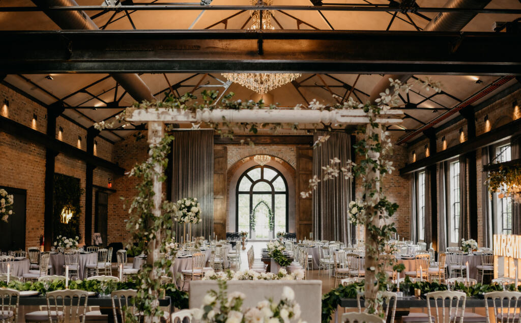 Houston wedding event rentals featuring elegant reception lighting, tables, and décor setup