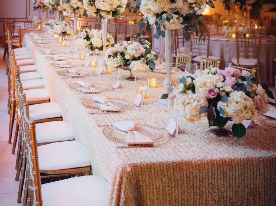 Wedding rentals Houston elegant reception table with florals and candles by EB Inc Events