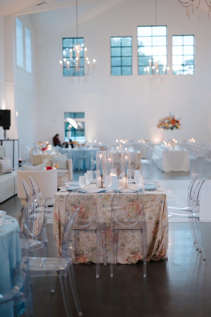 Elegant wedding reception setup for Amanda and Jacob with white Chiavari chairs and soft pastel linens – table and chair rentals near me by EB Inc Events in Houston