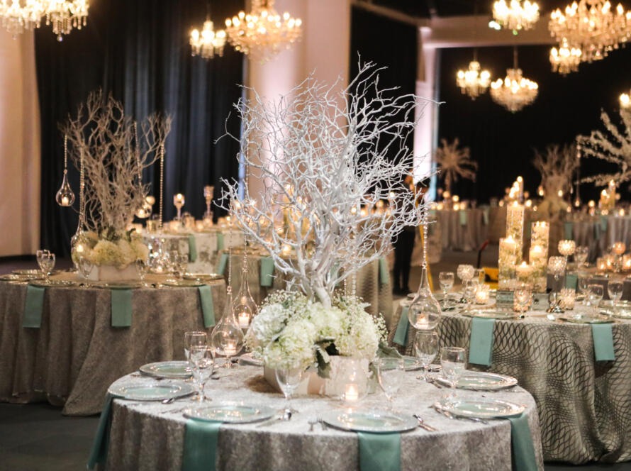 Elegant wedding reception setup by an event rental company Houston couples trust, featuring tables, linens, candles, and floral décor
