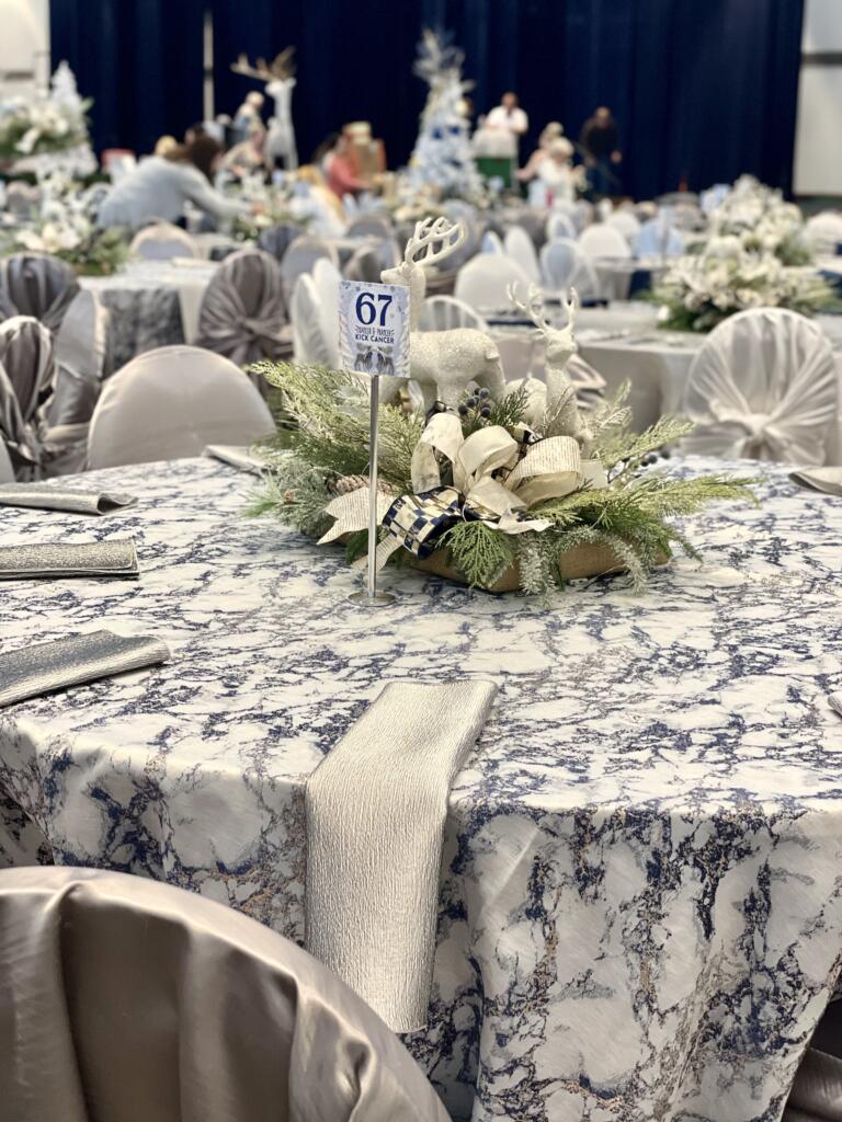 Elegant table setup with gray linens, floral centerpiece, and event décor from EB Inc Events – table and chair rentals near me in Houston