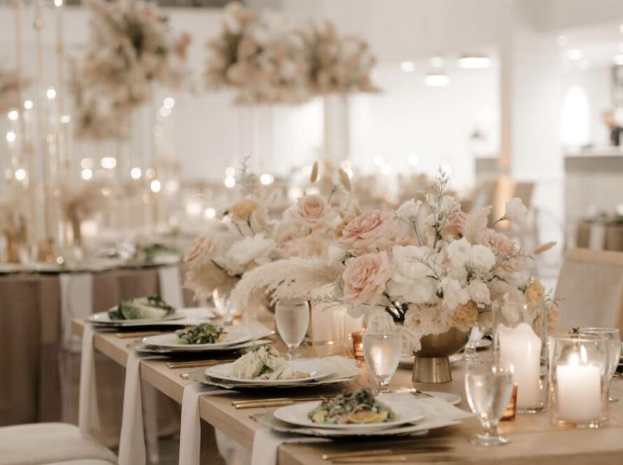 Elegant Neutral Wedding Tablescape With Florals and Candlelight