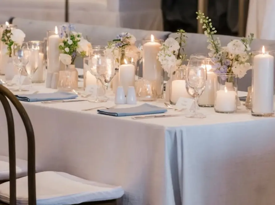 Luxury lounge tablescape with neutral linens and candlelight for event design rentals in Houston