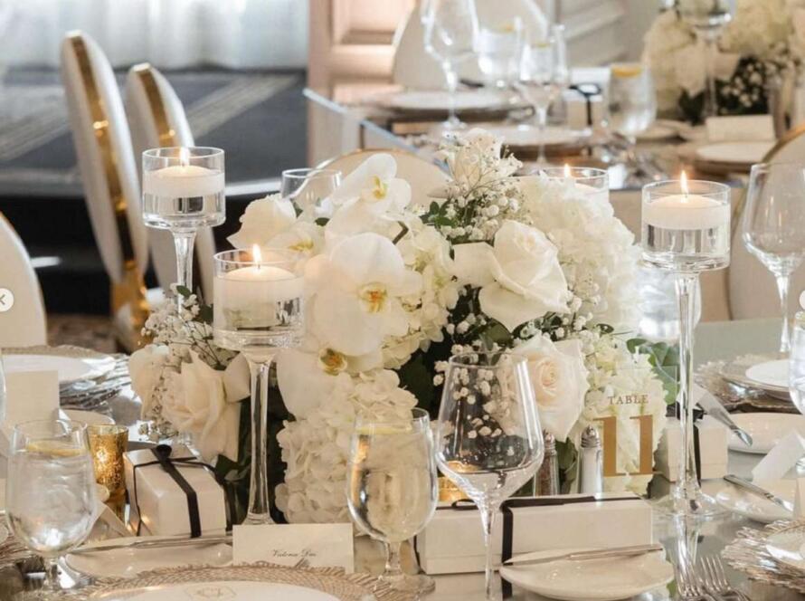 Luxury event rentals in Houston displayed through an elegant wedding tablescape with white florals and candle décor