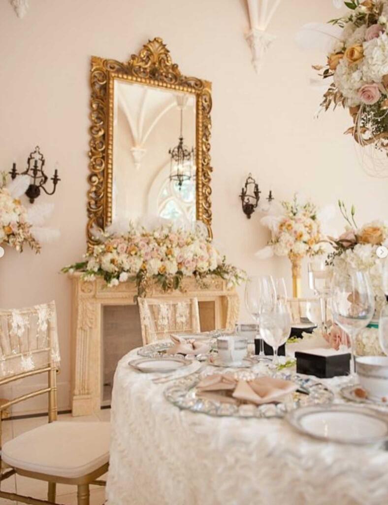 Luxury event rentals in Houston showcased through an elegant wedding tablescape with floral décor and gold accents