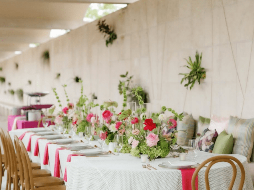 Elegant micro wedding table design in Houston featuring floral centerpieces, neutral linens, and wood chairs