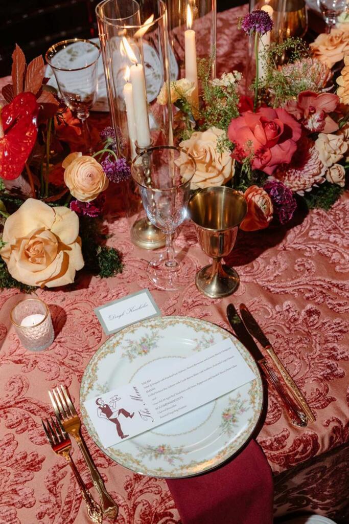 event table setup Houston with luxury floral centerpiece and candle decor