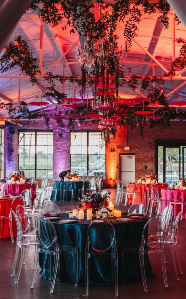 corporate event setup Houston with round tables, linens, and lighting reflecting event rental pricing Houston