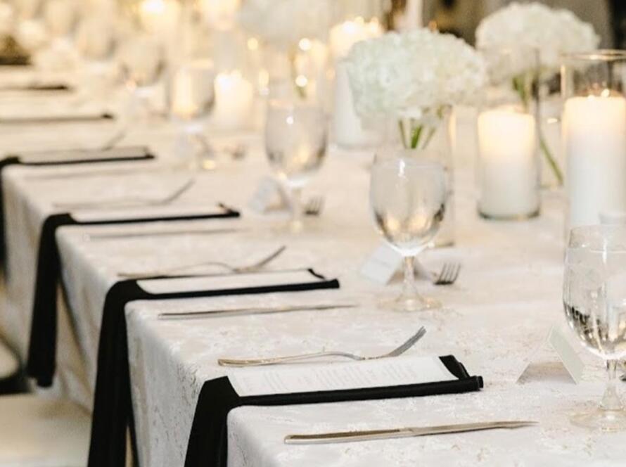 DIY vs event rentals long table setup with elegant linens, candles, and formal place settings