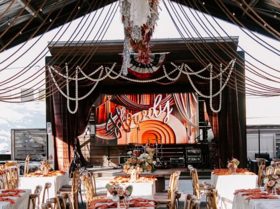 event rental packages Houston with stage setup tables chairs linens and lighting