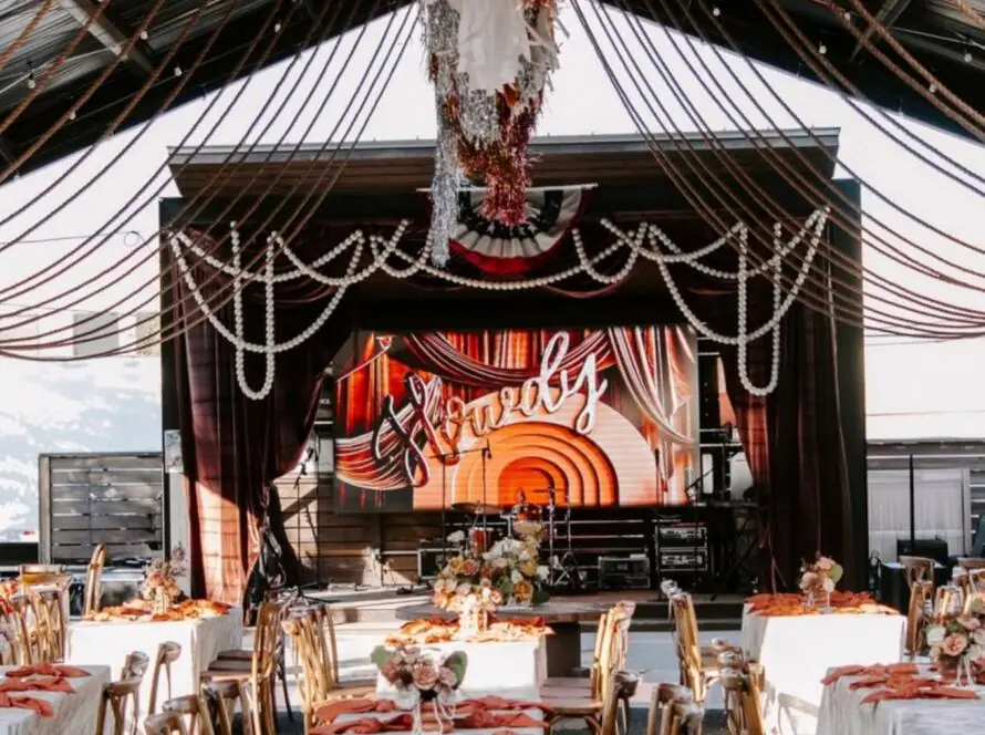 event rental packages Houston with stage setup tables chairs linens and lighting