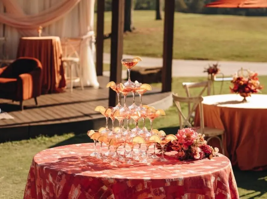 event planners Houston outdoor wedding reception setup with luxury rentals and cocktail table styling