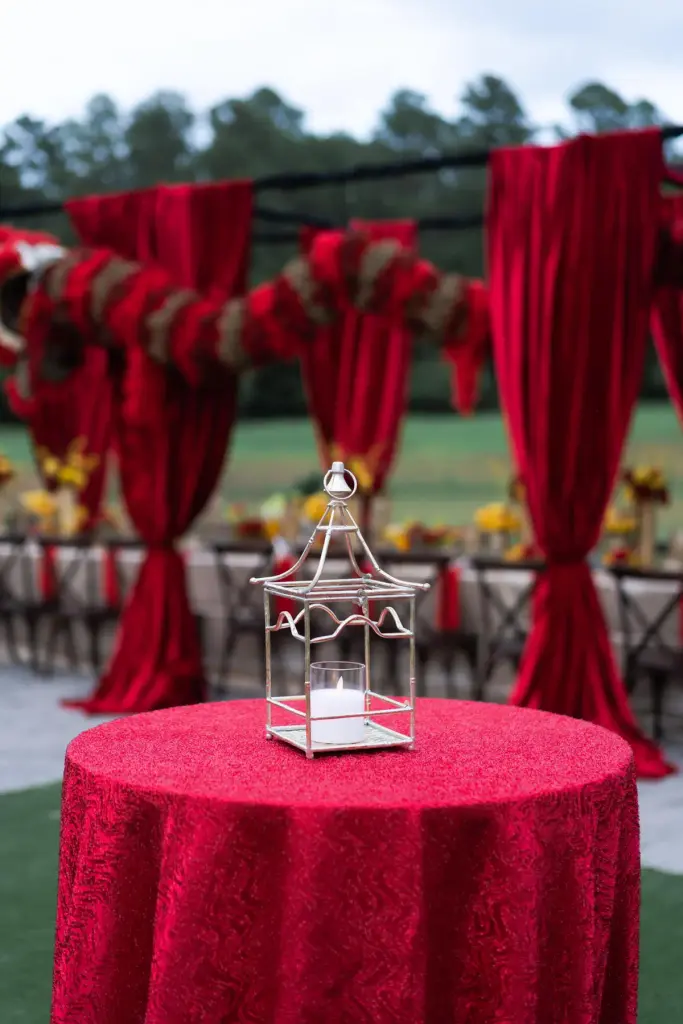 Red event draping Houston outdoor celebration with sequin table linen